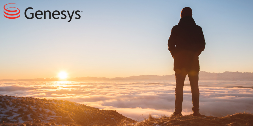 View From the back. A lonely standing man high in the mountains looks at the setting sun and the sunset horizon with a valley filled with clouds.