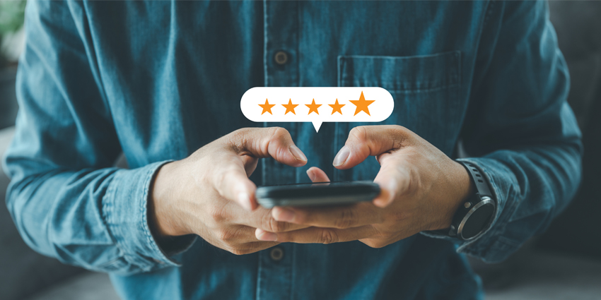 close up Man hand using smartphone with popup five star icon for feedback review satisfaction service, Customer service experience and business satisfaction survey.