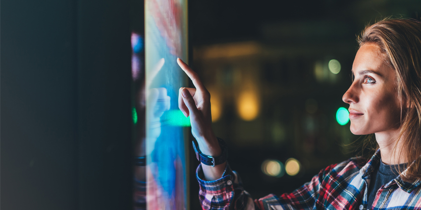 girl pointing finger to blank monitor display, hipster touch multimedia technology on light night city, click media lcd device, mockup screen information gadget