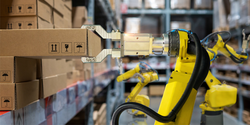 yellow robotic arm carry cardboard box in warehouse