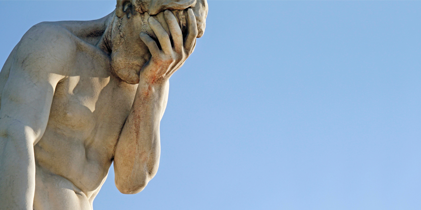 Facepalm - a statue with its head in its hand