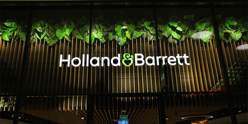 View on store front with logo lettering of Holland and Barrett health food