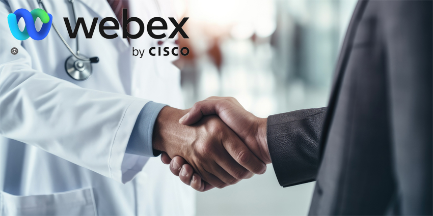 A close - up handshake between a doctor and a patient in a medical office with clean