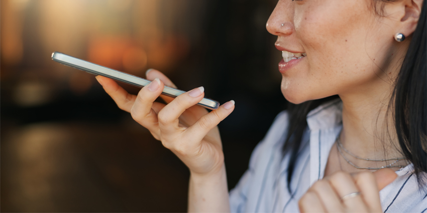 Woman, voice note and cafe with smartphone, remote work and conversation for job, online and internet. Discussion, excited and explaining for freelance career, copywriter and working on social