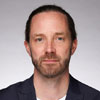 A headshot of Seb Glock
