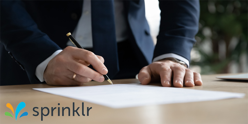 Close up young businessman standing near table with pen in hands, ready signing profitable offer agreement after checking contract terms of conditions, executive manager involved in legal paperwork