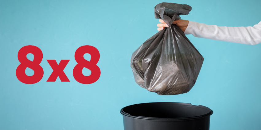 Hand holding garbage in plastic bag