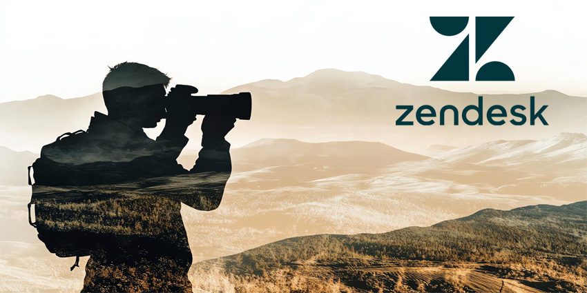 Silhouette of photographer in mountainous landscape.