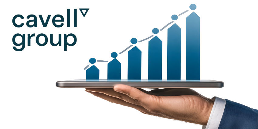 A businessperson's hand holding a tablet displaying financial growth charts and steady progress.