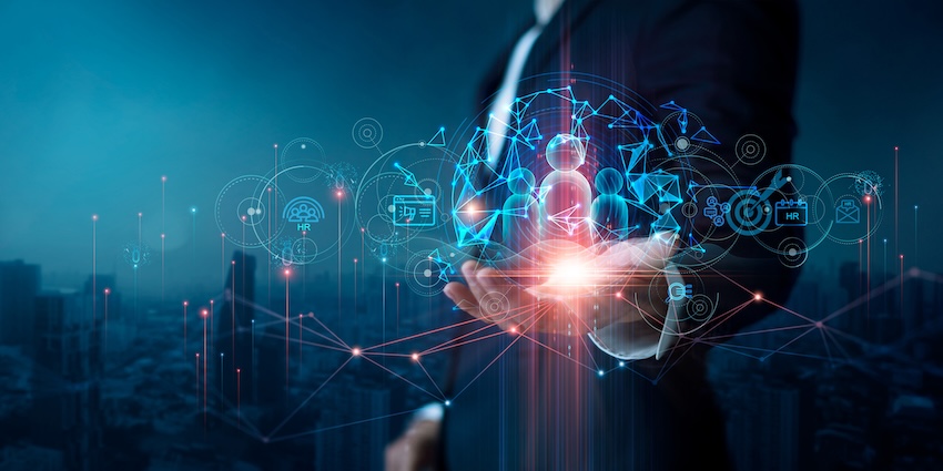 Digital illustration of workforce technology icons above a businessperson’s hand, representing modern workforce engagement management