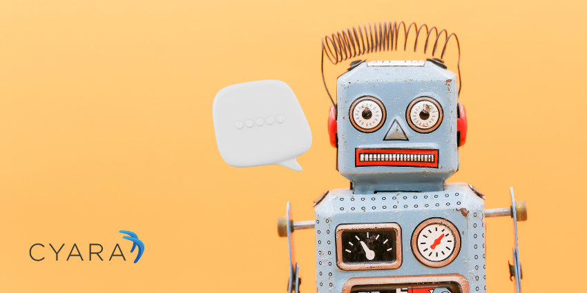 A vintage toy robot with a blue body, red ears, and a spring antenna stands against a bright orange background. A white speech bubble icon appears beside its head to represent a chatbot. The Cyara logo is displayed in the lower left corner.
